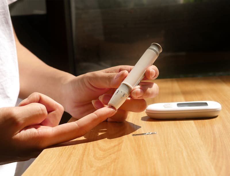 Checking blood sugar with a glucose meter
