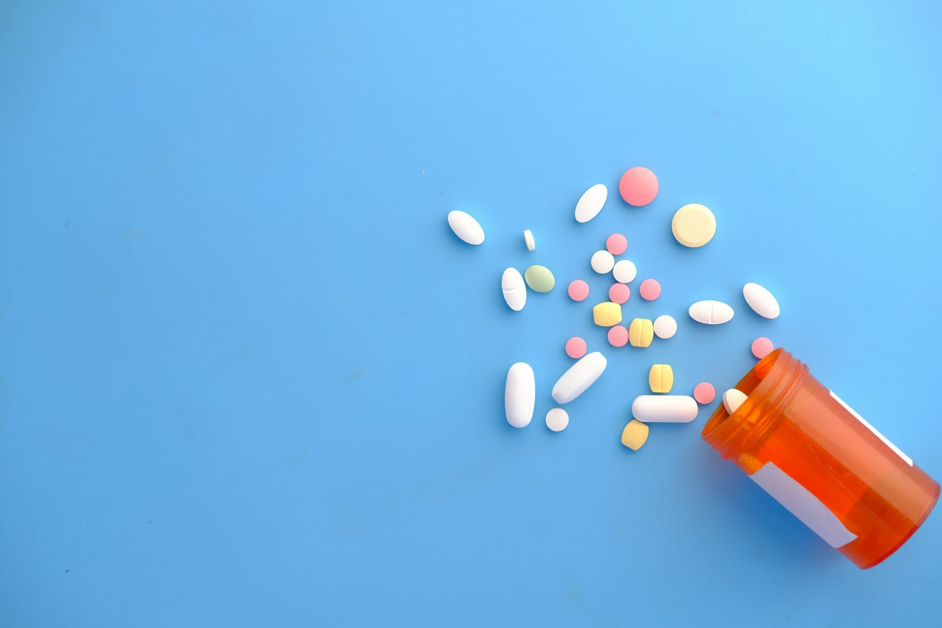 Colourful capsules from a bottle